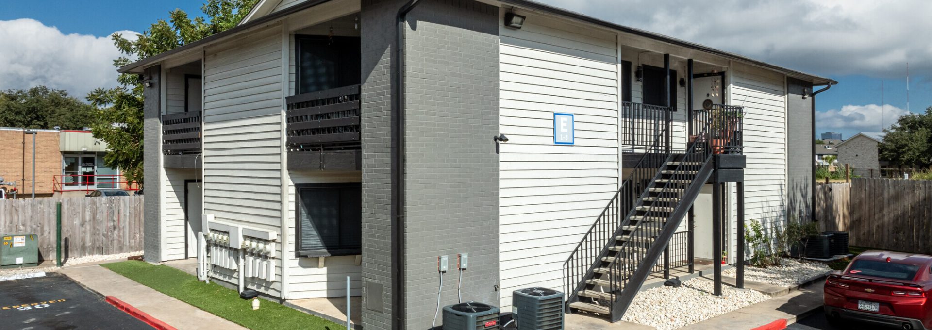 the apartment complex is located in a parking lot at The Colony Creek Apartments